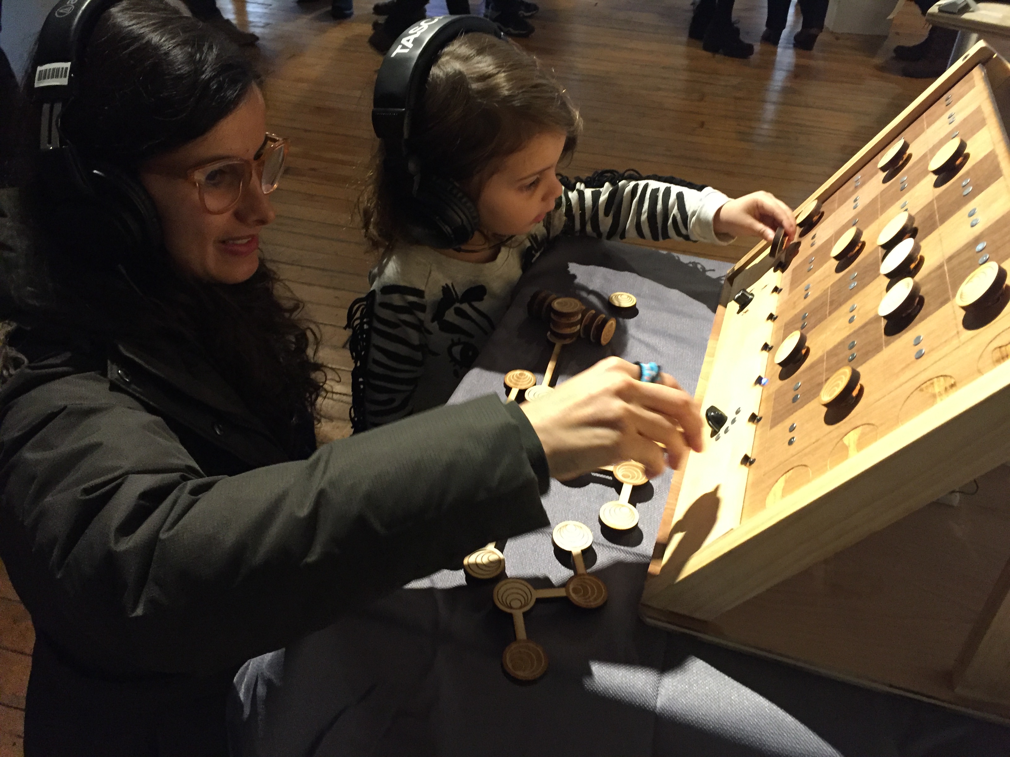 Mother and child making music together